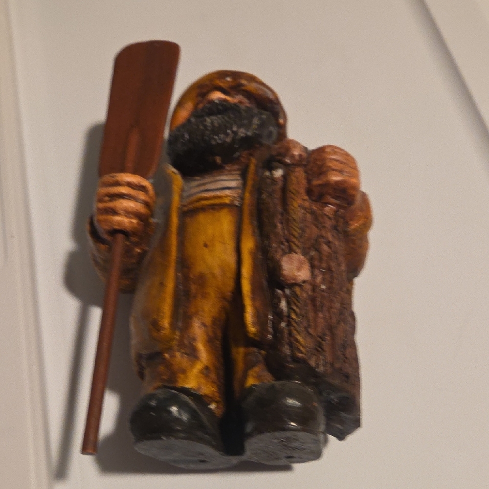 Rustic Wood Carved Figure with Paddle